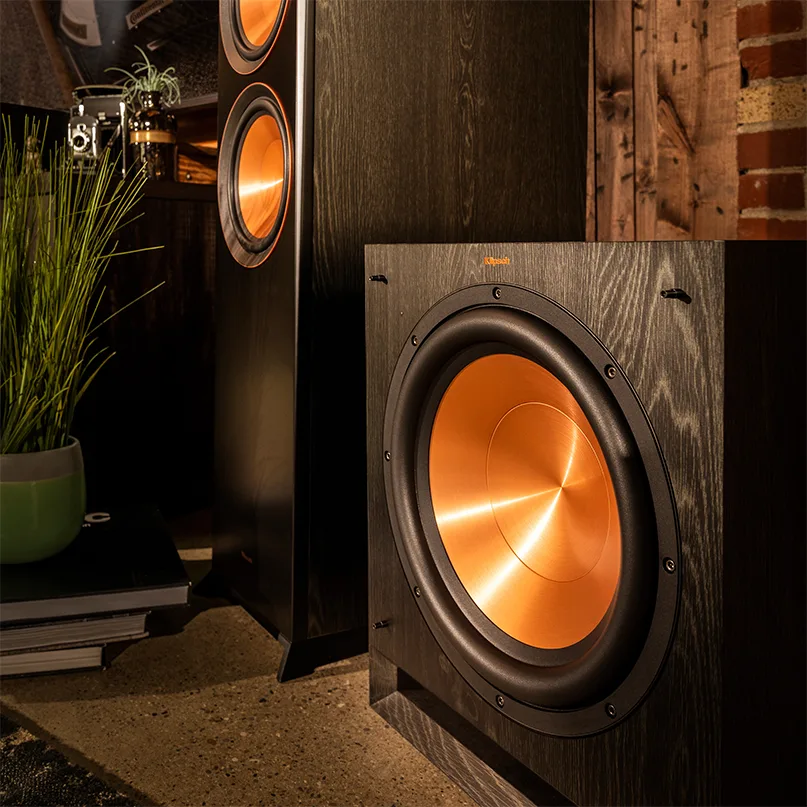 Klipsch Spl-120 Subwoofer Klipsch floorstanding speaker with copper-colored woofer cone in a black woodgrain cabinet