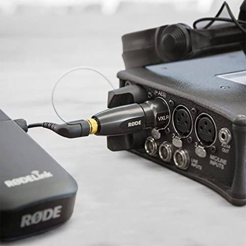 Rode Vxlr+ Rode wireless microphone system connected to a multi-input audio mixer with xlr ports.