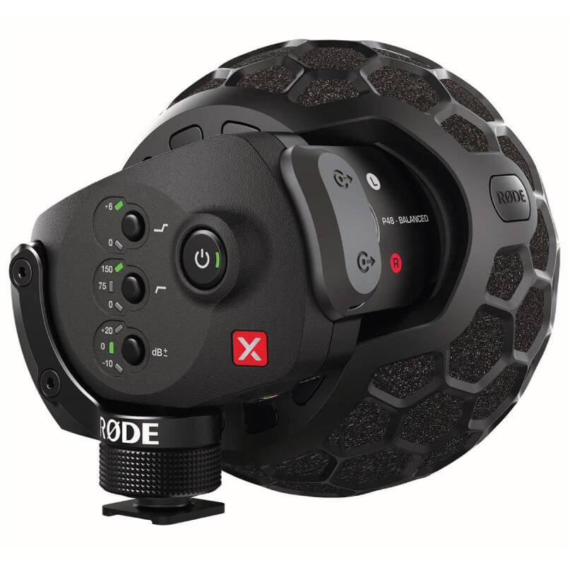 Rode Stereo Videomic X Close-up of a black rode stereo videomic x sound recording microphone with a textured spherical windscreen and control buttons, viewed from the side.