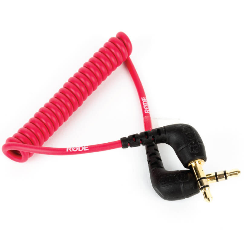 Rode Videomicro Rode sc2: red coiled audio cable with right-angle black connectors on both ends, equipped with gold-plated 3. 5mm plugs—designed for dependable audio connections in rode sc2 setups.