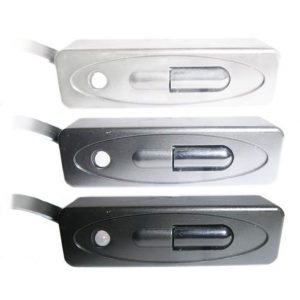 Three Forte A-Bus IRR-450 Mini Infra Red Receivers, each housed in a rectangular inline casing available in silver, dark gray, and black finishes, featuring a sliding switch and a small circular button near the edge.