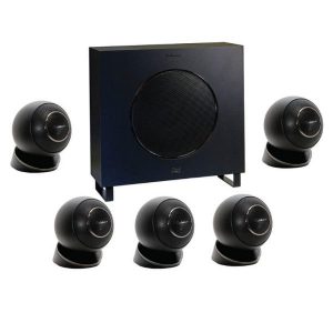 A Cabasse Eole 4 5.1 System in black, featuring a subwoofer and five matching spherical satellite speakers, is arranged in a semi-circle on a white background.