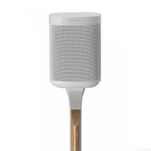 A Sonos PLAY:1/ONE speaker in white is displayed on a Flexson Adjustable Floor Stand, which features a wooden accent, set against a plain white background.
