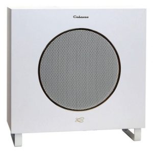 The Cabasse Lipari 21 is a white rectangular speaker with a central circular grille in black and silver, two short legs, and the “Cabasse” logo displayed at the top.