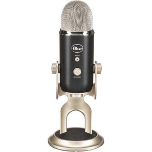 A BlueMicrophones Blue YETI PRO Professional USB Microphone stands upright on a metal base, featuring control knobs, a mute button, and a mesh grille on top.