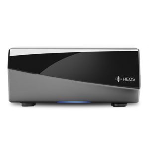 A black and gray rectangular HEOS Amp HS2 Multi-Room Sound System with a glossy front panel, logo on the right, and two short feet, shown on a white background.