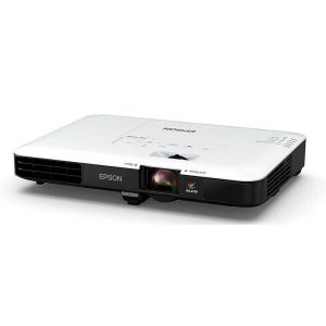 The Epson EB-1780W Ultra-mobile Business Projector, featuring a white and black design with control buttons and vents, is shown resting at a slight angle on a flat surface.