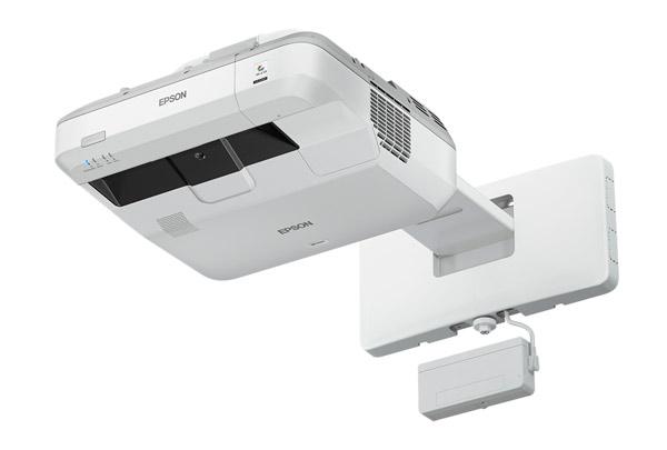 Epson Eb-710Ui Ultra Short Throw Projectors Ceiling-mounted epson eb-710ui ultra short throw projector with a white wall bracket, ventilated sides, and a separate attached sensor or accessory module.
