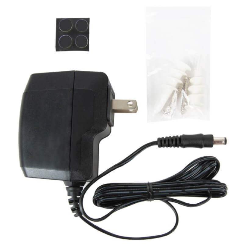 Araknis Networks 110-Series Single-Wan Gigabit Vpn Router Black ac adapter with two-prong plug and long dc barrel cable, includes small bag with screws.