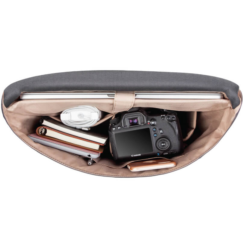 Moshi Aerio Messenger Bag 15&Quot; Canon dslr camera inside a tan camera bag with usb cable and notebooks.