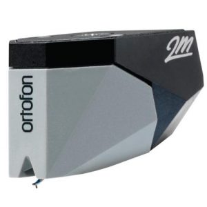 Interdyn Ortofon 2m moving magnet turntable cartridge with a grey faceted body, black top, and visible stylus.