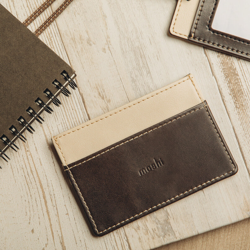 Moshi Slim Wallet Two-tone brown and beige leather card holder with contrast stitching and an embossed logo.
