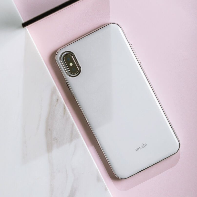Moshi Iglaze For Iphone Xs Max White smartphone with a moshi case and vertical dual-camera module on a pink marble surface.
