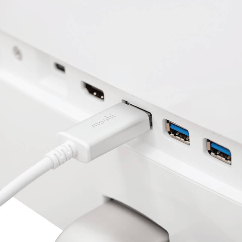 Moshi Usb-C To Displayport 5K Cable Moshi usb-c hub adapter connected to a white device, featuring two blue usb 3. 0 ports.