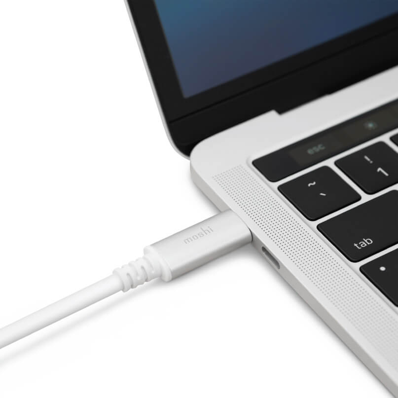 Moshi Usb-C To Displayport 5K Cable Moshi usb-c charging cable plugged into a silver laptop.
