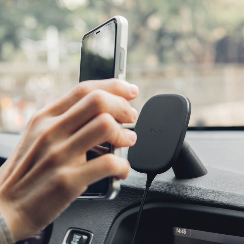 Moshi Snapto Magnetic Car Mount With Wireless Charging Moshi car wireless phone charger mount with square black pad on dashboard