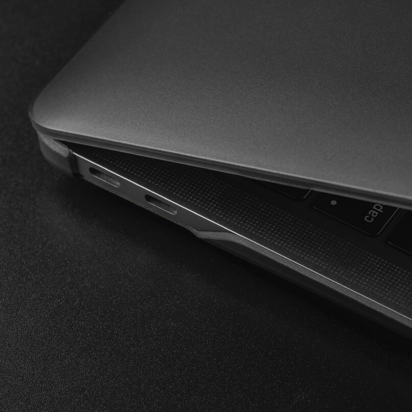 Moshi Iglaze For Macbook Air 13 (Thunderbolt 3/Usb-C) Close-up of a dark metallic laptop edge with a usb-c port and textured palm rest