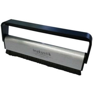 Inakustik cleaning brush with a metal bar and black bristles in a black frame.