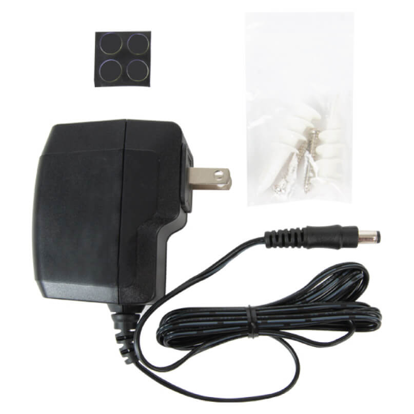 Araknis Networks 110-Series Single-Wan Gigabit Vpn Router With Wi-Fi Ac power adapter with two-prong us plug and dc barrel output, includes cord, mounting pads, and screws.