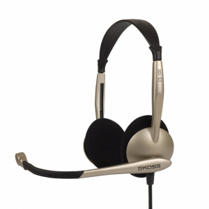 Koss CS-100 over-ear headset with gold-toned frame, black foam ear pads, and attached microphone boom