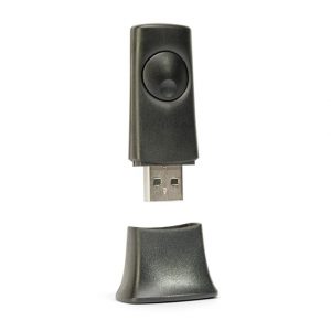 Black USB dongle with a large circular button on its textured housing and a detachable cap.
