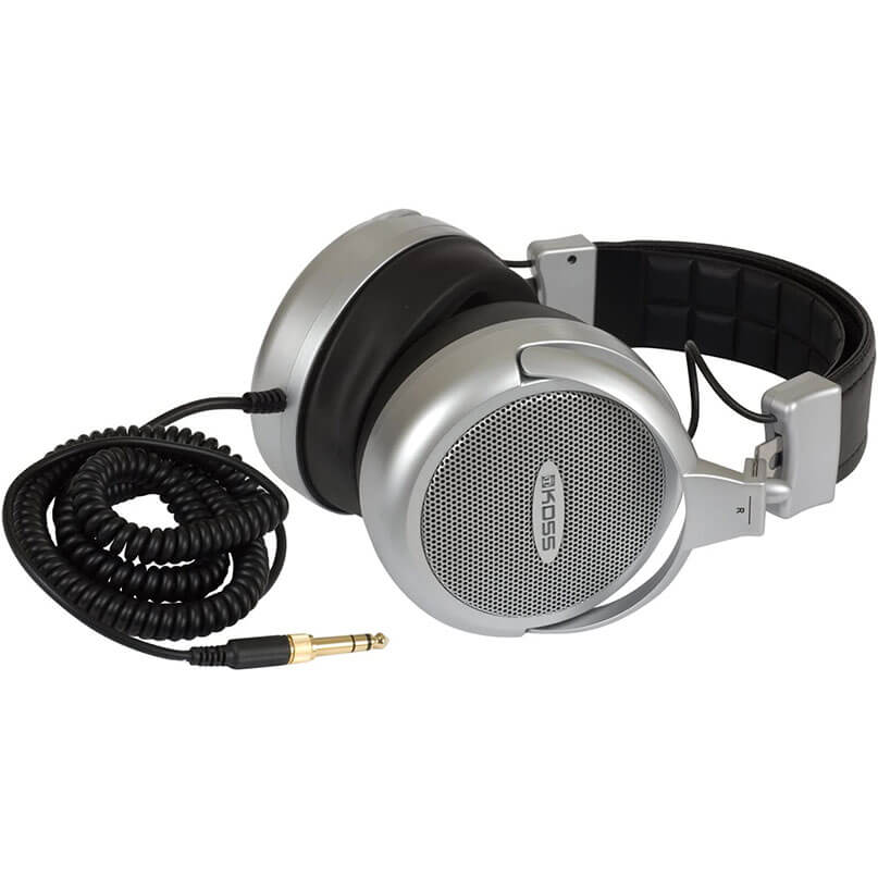 Koss Full Size Headphones - Pro4Aaat Koss over-ear headphones feature silver mesh earcups, a black headband, and a coiled 3. 5mm audio cable.