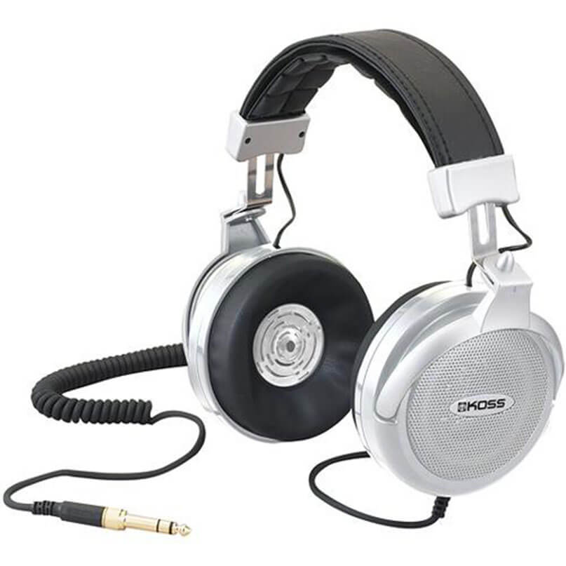 Koss Full Size Headphones - Pro4Aaat Koss over-ear headphones with silver metal frame, black headband, cushioned ear cups, and coiled cable with 1/4-inch adapter