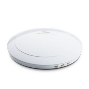 White circular wireless charging pad with a subtle logo on the top and USB ports along the edge.
