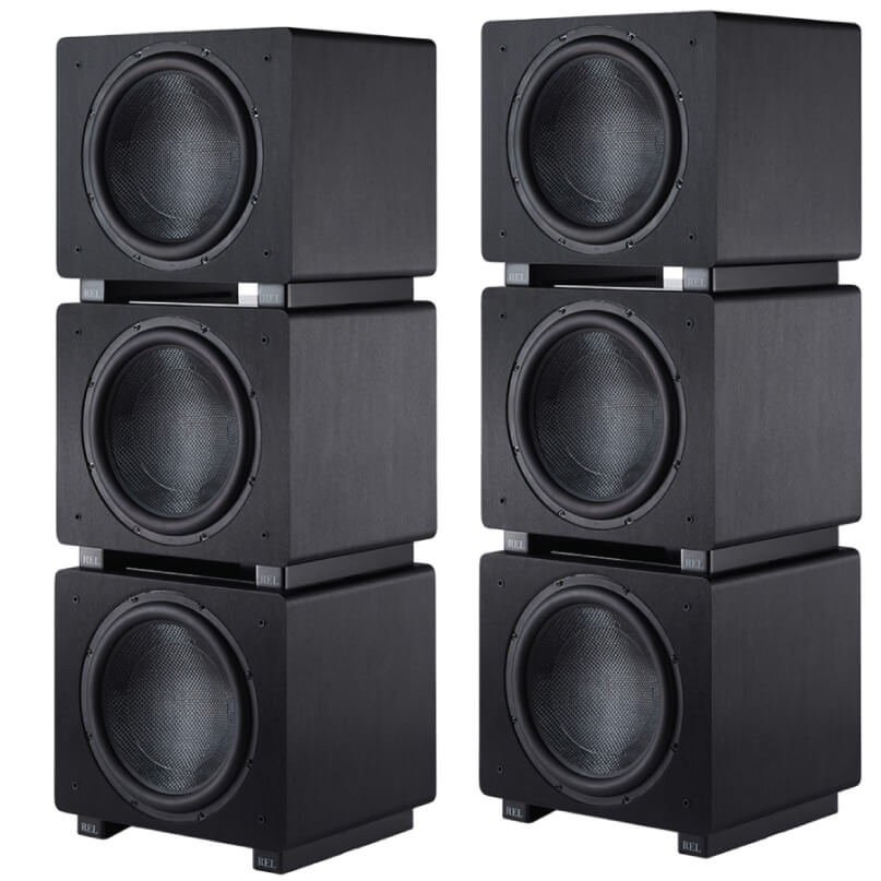 Rel Ht/1508 Two vertical stacks of three black rel subwoofers with large front-facing drivers.