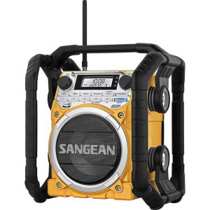 Sangean rugged yellow portable radio with large front speaker, digital display, protective frame, and side handles.