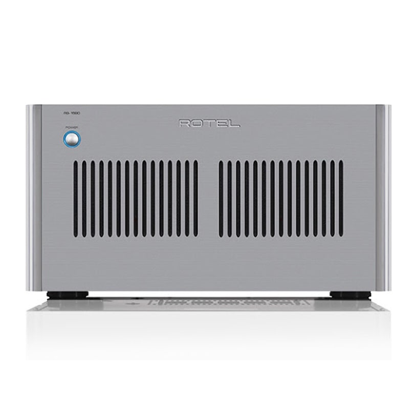 Rotel Rb-1590 Stereo Power Amplifier Rotel stereo power amplifier front panel with vertical vent slots and blue power button.