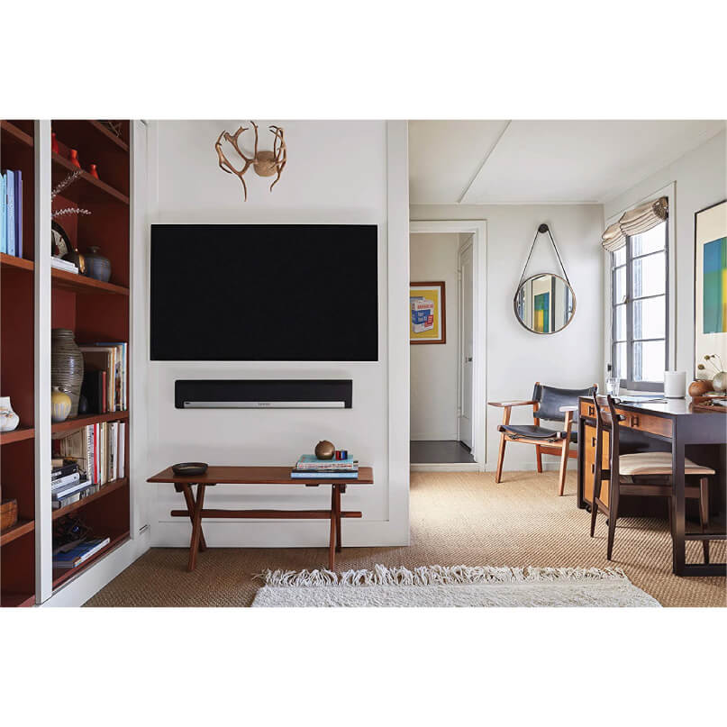 Sonos Playbar Wall Mount Kit Flat-screen television with a slim soundbar mounted beneath it on a white living-room wall.