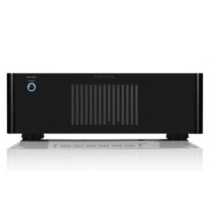 Interdyn Rotel power amplifier with black chassis, blue power button on the left, and vertical cooling fins in the center.