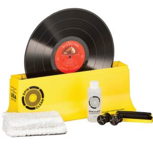 Interdyn Spin-clean record washing kit with yellow tub, vinyl lp, cleaning fluid bottle, microfiber cloths, and wash accessories.