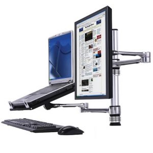Adjustable monitor and laptop mounting arm with keyboard and mouse on a desk.