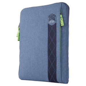 STM Australia blue fabric tablet sleeve with logo patch, vertical diamond-stitched strap, and lime zipper pulls.