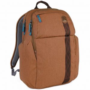 Brown STM backpack with padded gray back, blue zipper pulls, front vertical strap with orange stitching, two main compartments.