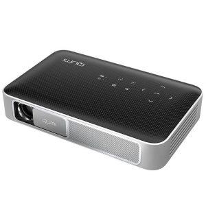 Qumi mini projector with black textured top, silver trim, lens on the left.