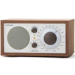 Tivoli Audio Model One tabletop radio with wood cabinet, large tuning dial and front speaker grille.