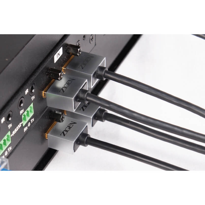 Zigen Hdmi- 1M Cable Three zgen fiber optic transceiver modules mounted on a rack with black cables connected.