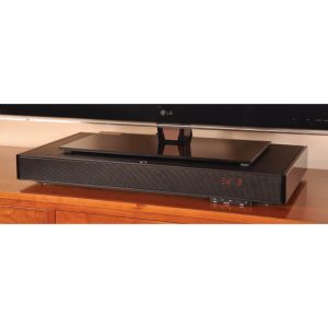 Long black soundbar with red LED display sits on a wooden cabinet beneath an LG flat-screen TV.