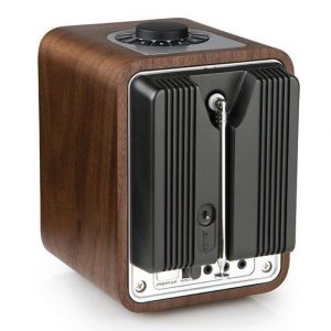 Wooden retro-style AM/FM radio with black ribbed back panel, chrome trim, and top circular tuning dial.
