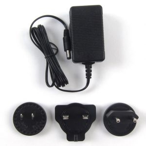 Interdyn Black universal travel power adapter with three interchangeable plug heads.