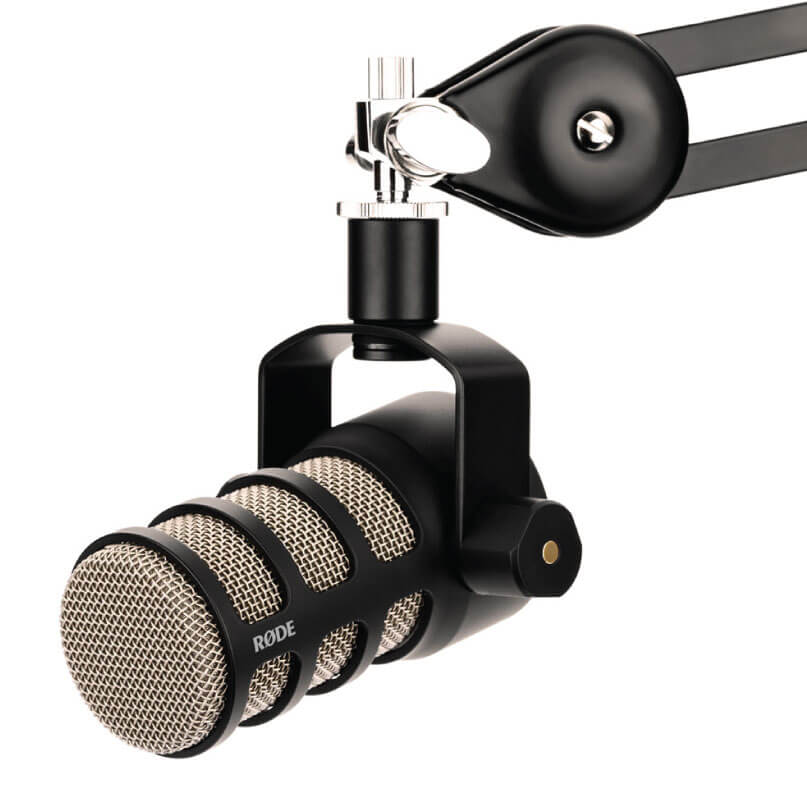 RODE microphone with metal mesh grille, mounted on a black shock mount connected to a boom arm.