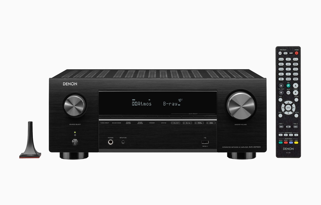 Denon Avc-X3700H Denon av receiver with black brushed finish, front display, dual large knobs, remote, and small antenna.