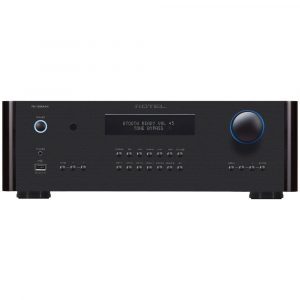 Interdyn Rotel rc-1590mkii stereo integrated amplifier with blue ring power button, central display, and large blue volume knob.