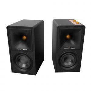 Pair of black Klipsch McLaren floorstanding loudspeakers with carbon-fiber woofers and orange binding posts on top panel.