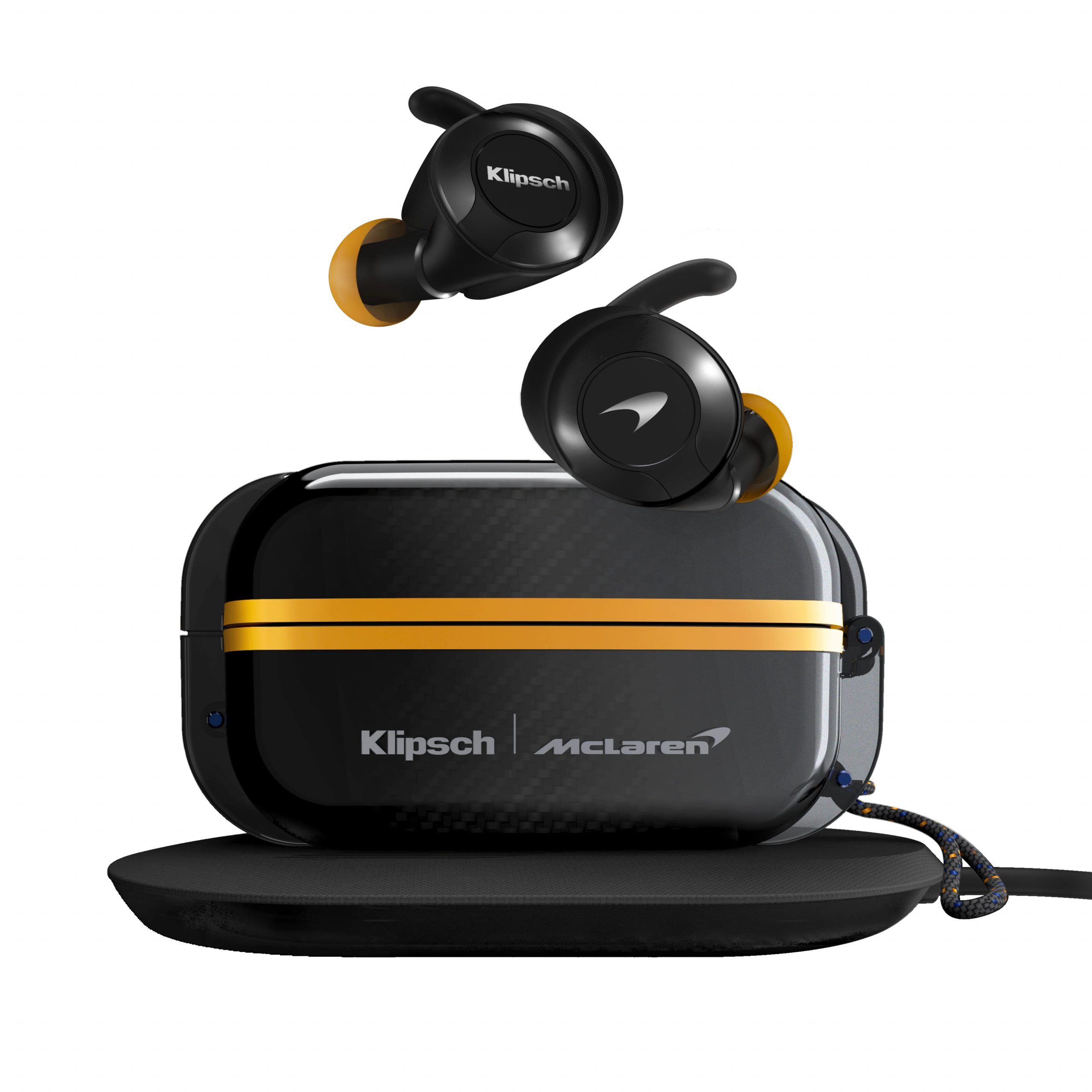 Klipsch McLaren true wireless earbuds with black housing, orange tips, and a carbon fiber case with a gold band.