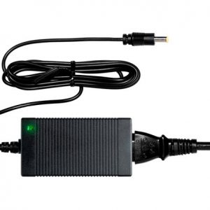 Interdyn Black rectangular ac/dc power adapter with green led, ribbed case, attached input cord and coaxial output plug.