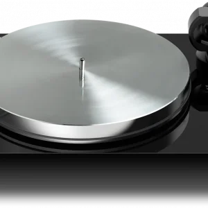 Turntable with brushed metal platter, black glossy base, and right-side tonearm with cartridge.